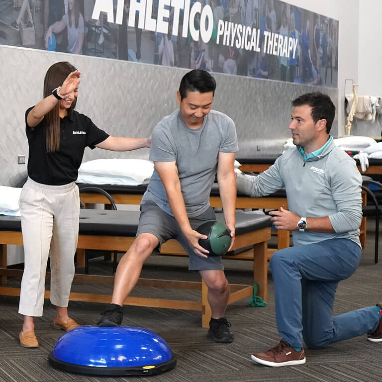 Man and woman helping patient